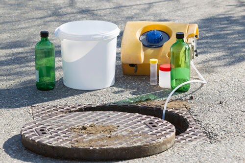 An automated sampler that is collecting a sample from a sewer line. An automated sampler that is collecting a sample from a sewer line.