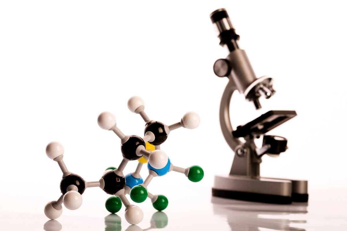 A microscope and a model of a molecule, showcasing the power of atomic force microscopy for surface imaging at atomic resolution. A microscope and a model of a molecule, showcasing the power of atomic force microscopy for surface imaging at atomic resolution.