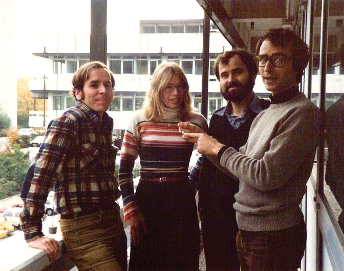 Image of four people standing side by side. Image of four people standing side by side.
