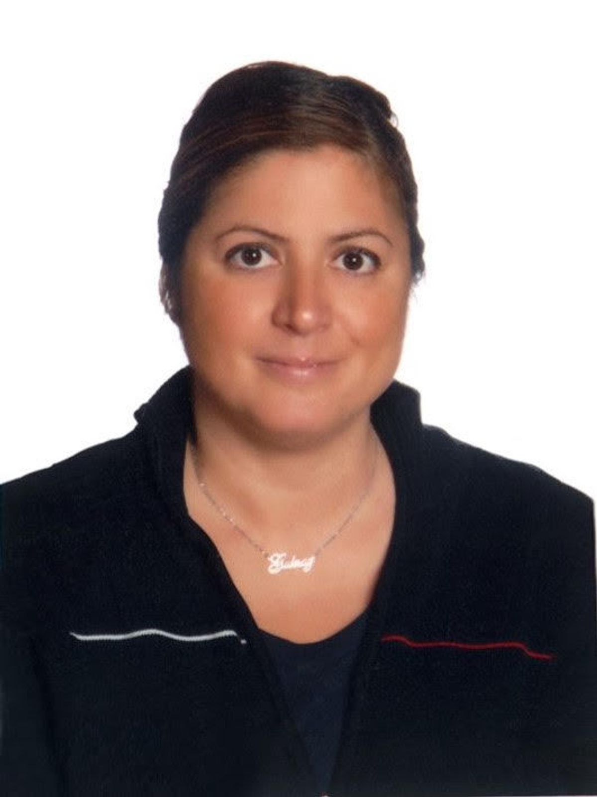 Portrait of scientist wearing a black shirt and facing the camera, with a white background. Portrait of scientist wearing a black shirt and facing the camera, with a white background.