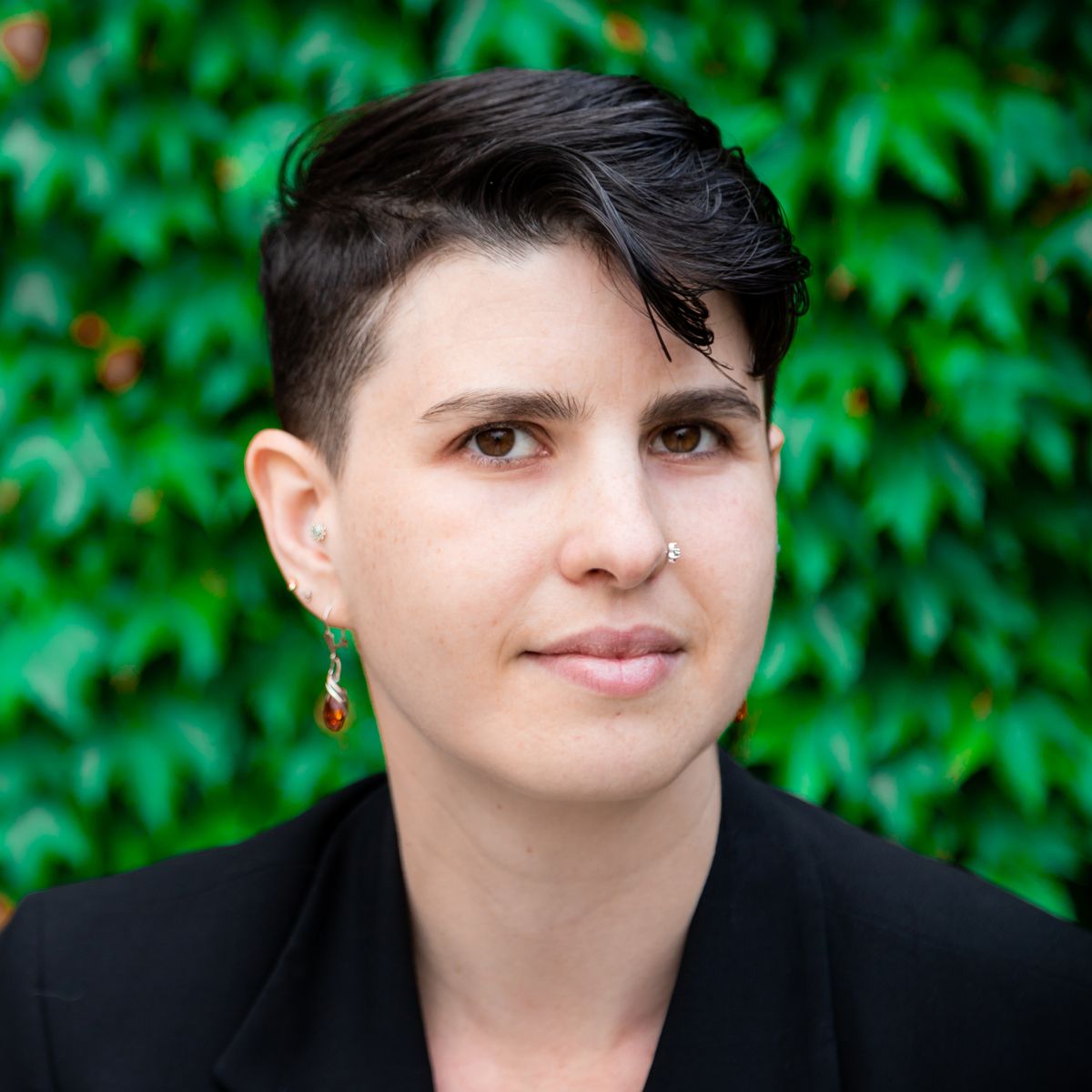 Image of Erica Hartmann, who wears a dark jacket and faces the camera. Image of Erica Hartmann, who wears a dark jacket and faces the camera.