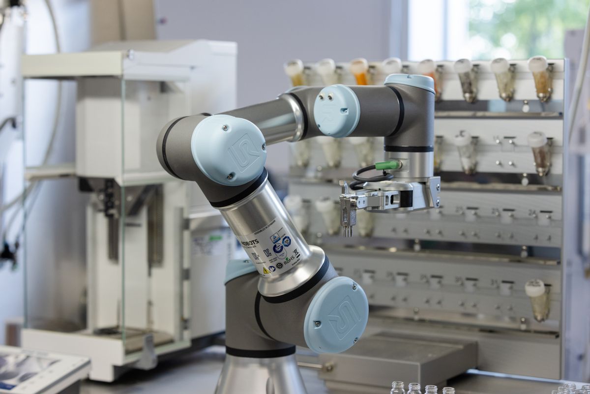A robotic arm in a laboratory. A robotic arm in a laboratory.