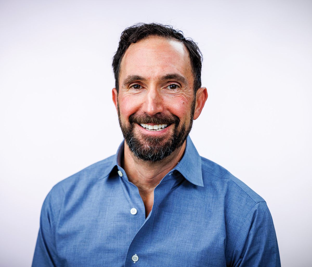 Photograph of Stephen De Rosa, an immunologist at the University of Washington and who was a postdoctoral researcher for the Herzenberg lab. He is wearing a blue shirt, has a thin beard, and is smiling for a professional headshot. Photograph of Stephen De Rosa, an immunologist at the University of Washington and who was a postdoctoral researcher for the Herzenberg lab. He is wearing a blue shirt, has a thin beard, and is smiling for a professional headshot.